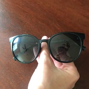 Slightly round black sunglasses